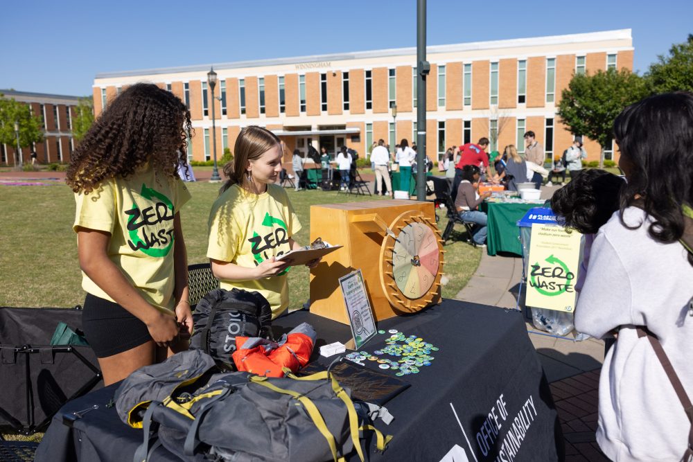 Office of Sustainability EcoReps engage with fellow students during an informational tabling event